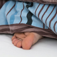 Foto von Julias Füßen im Bett